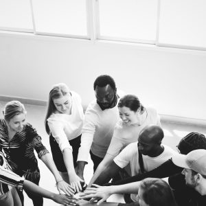 Diversity teamwork with joined hands